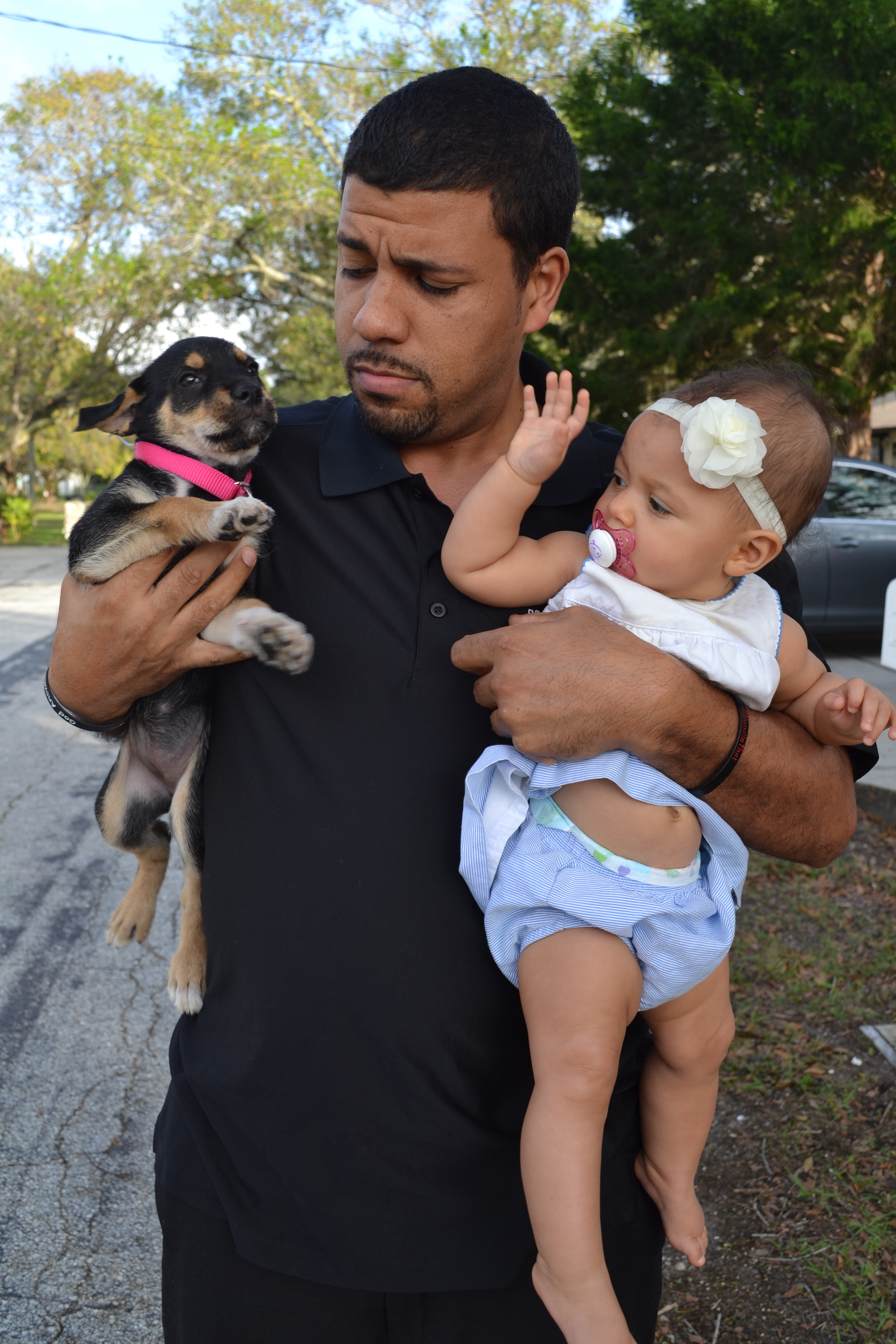 Marty's husband, baby, and the neighbor's puppy. Cute overload!